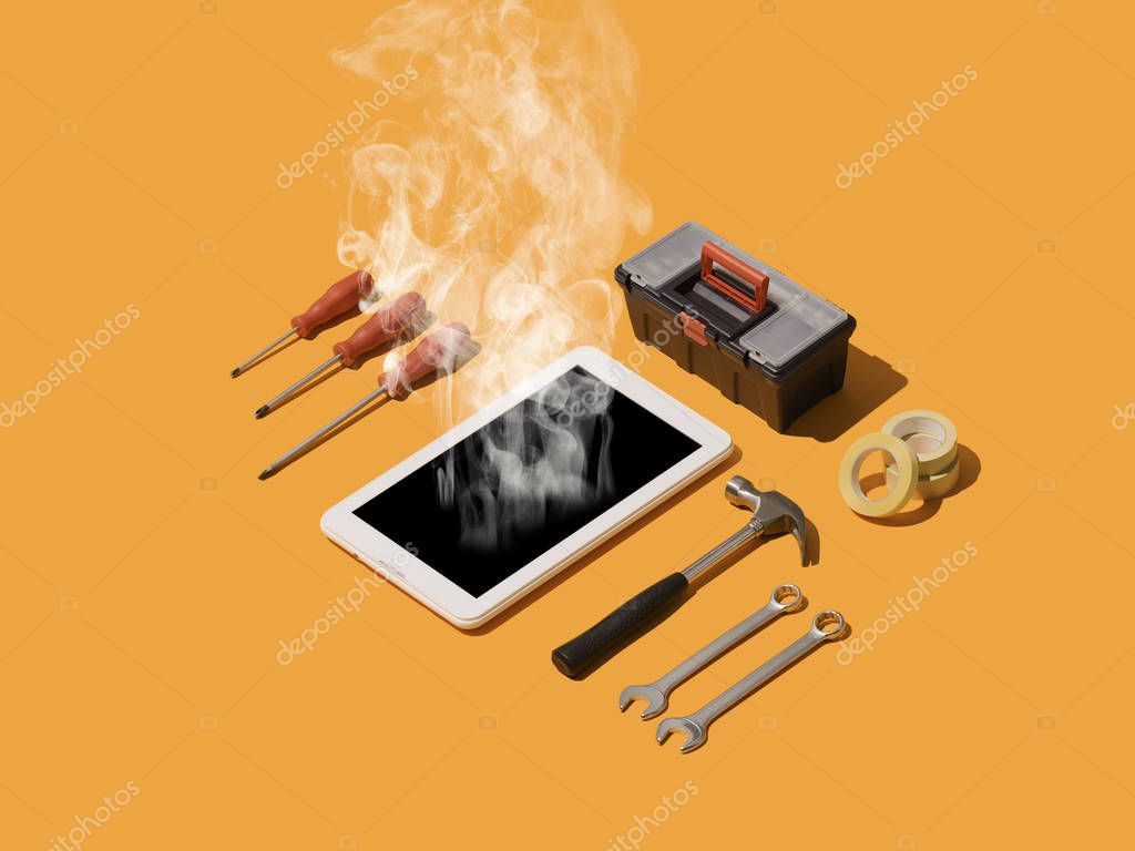 Smartphone being repaired with precision tools