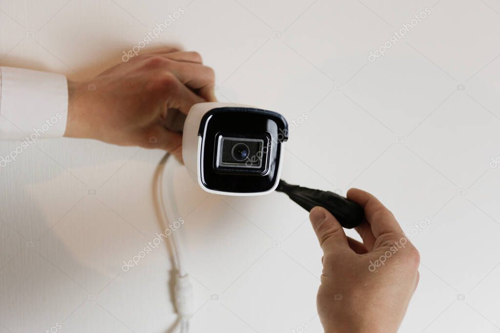 Security camera installed on a home exterior wall