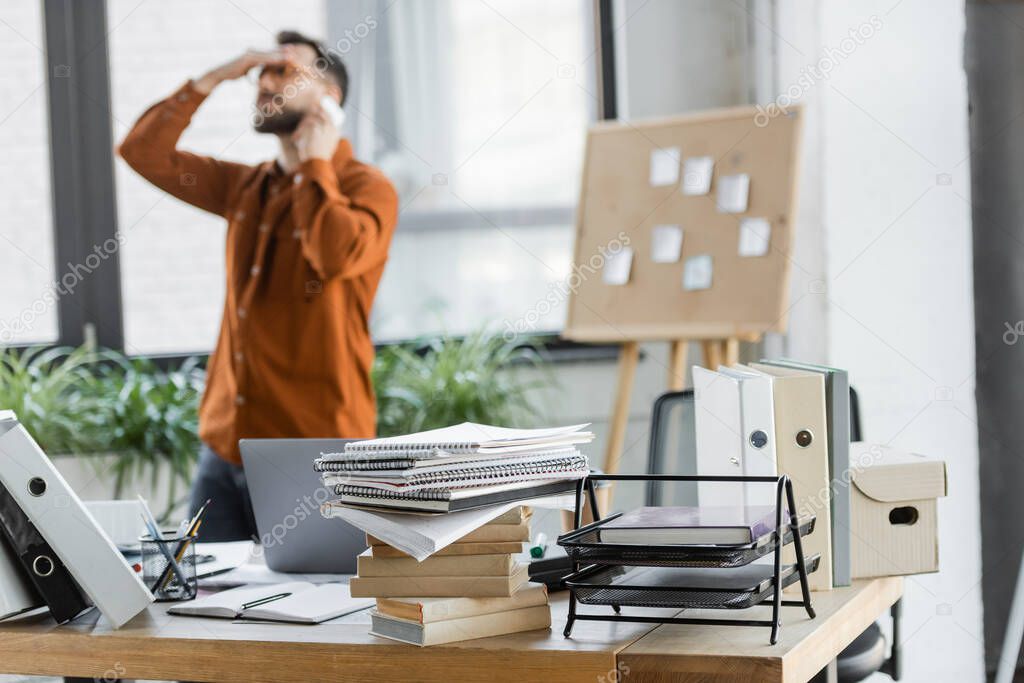 Professional working on a business laptop at a desk